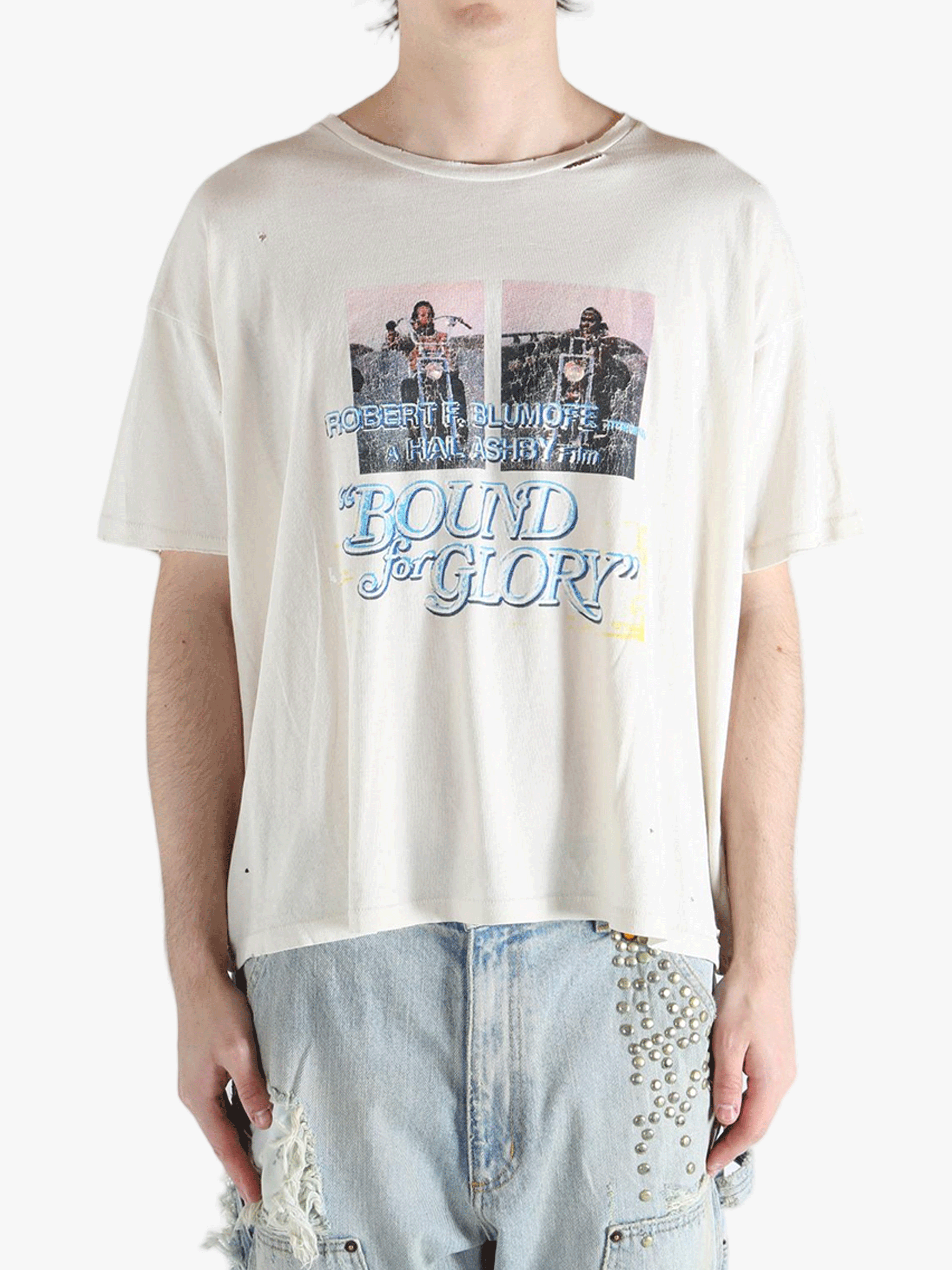 White t-shirt worn by a person, showing the shirt's fit