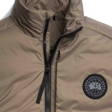 Close up of brown vest,showing texture of the polyamide fabric.