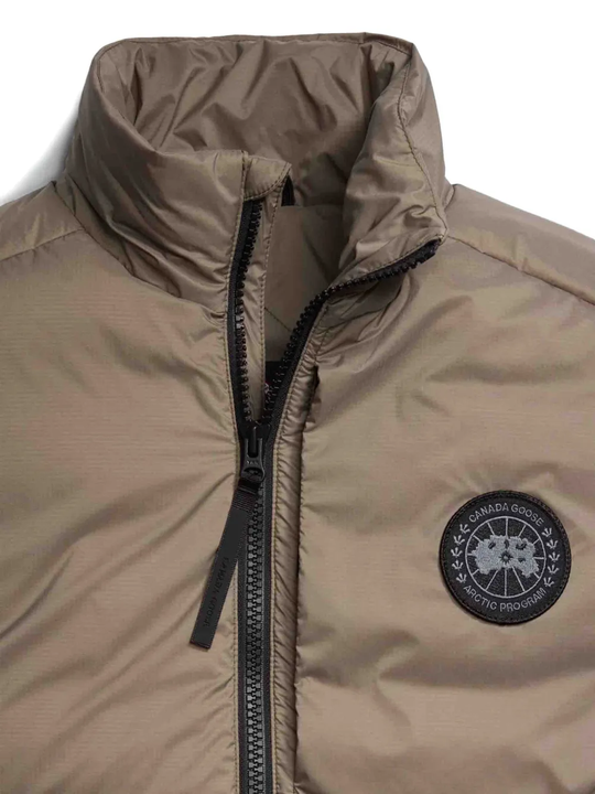 Close up of brown vest,showing texture of the polyamide fabric.