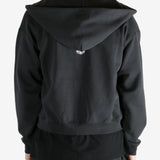 Black hoodie worn by a person, showing the hoodie's fit