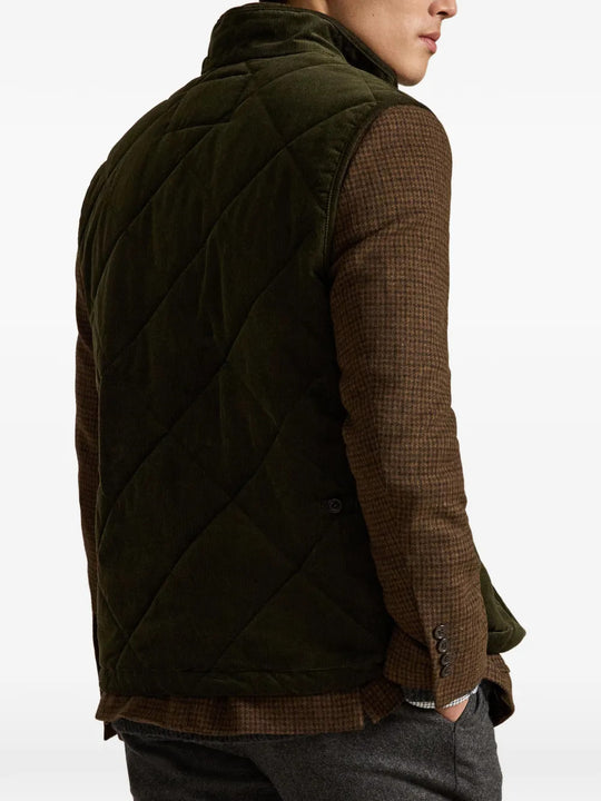 Green jacket worn by a person, showing the jacket fit