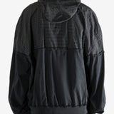 Black sweater worn by a person, showing the sweater's fit