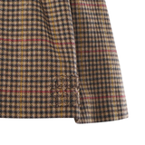 Close up of brown skirt, showing texture of the Virgin Wool fabric