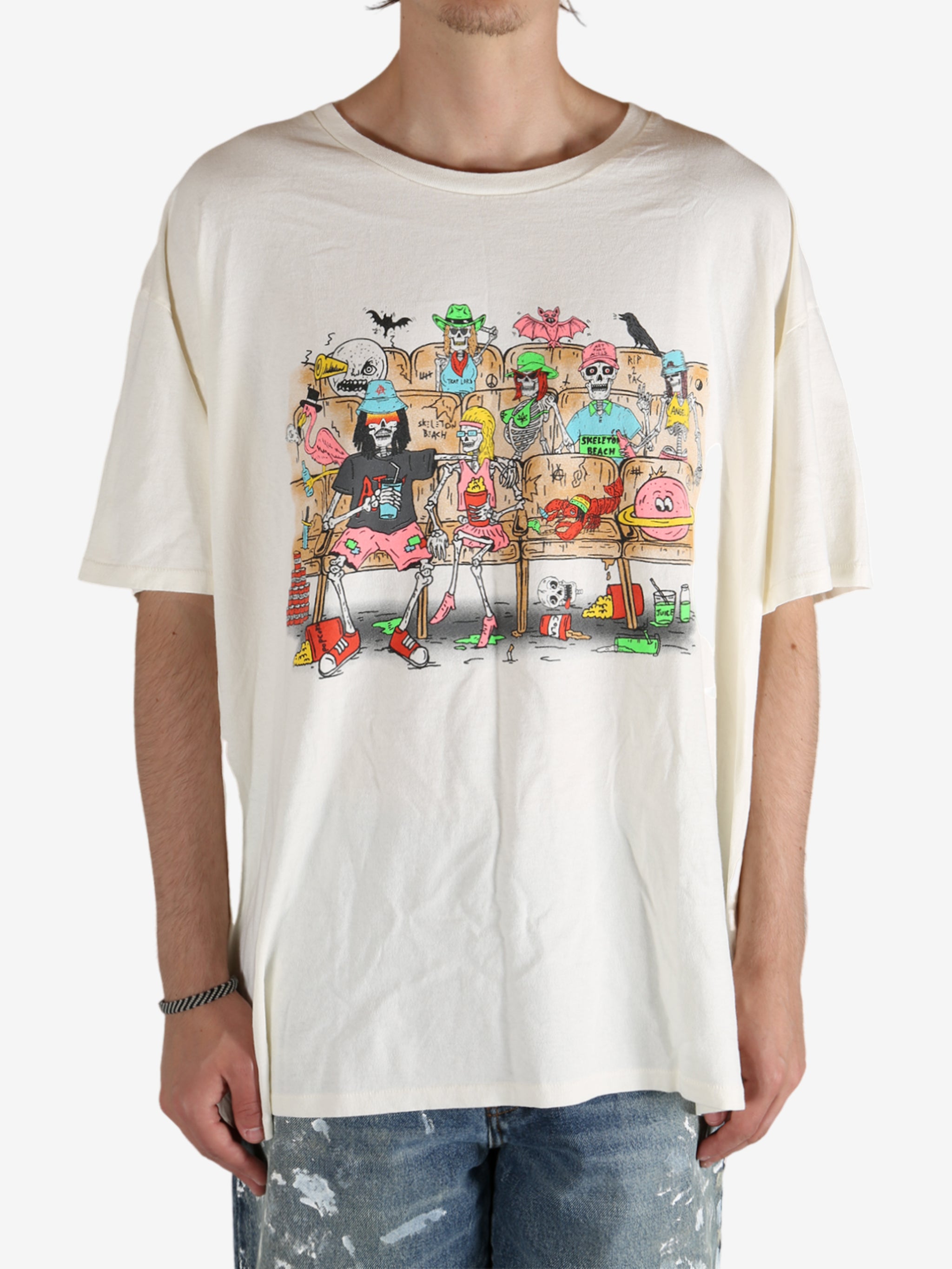 White t-shirt worn by a person, showing the shirt's fit