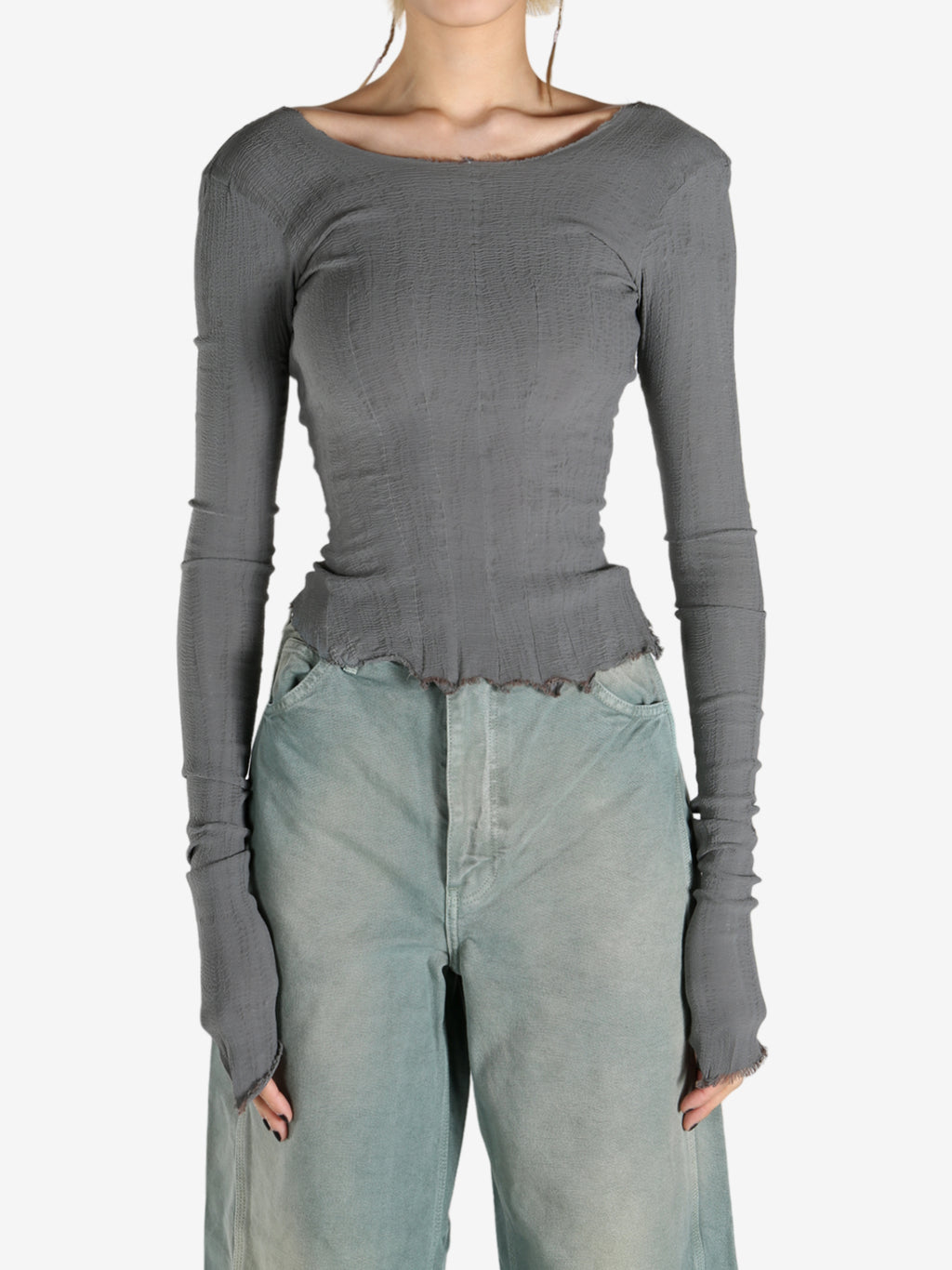 Grey tops worn by a person, showing the tops fit