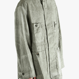 Green jacket worn by a person, showing jacket's fit
