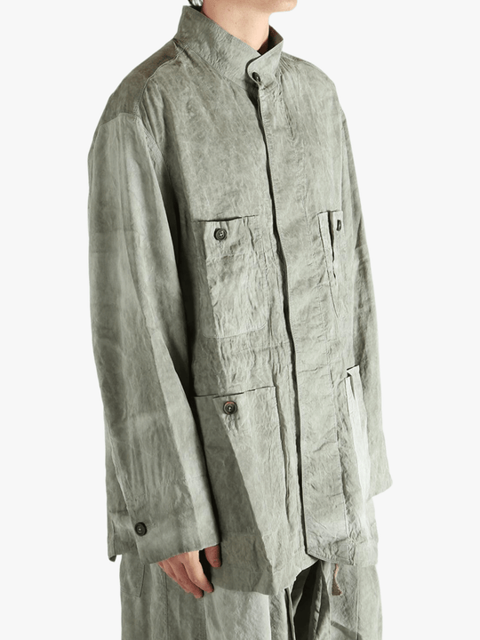 Green jacket worn by a person, showing jacket's fit