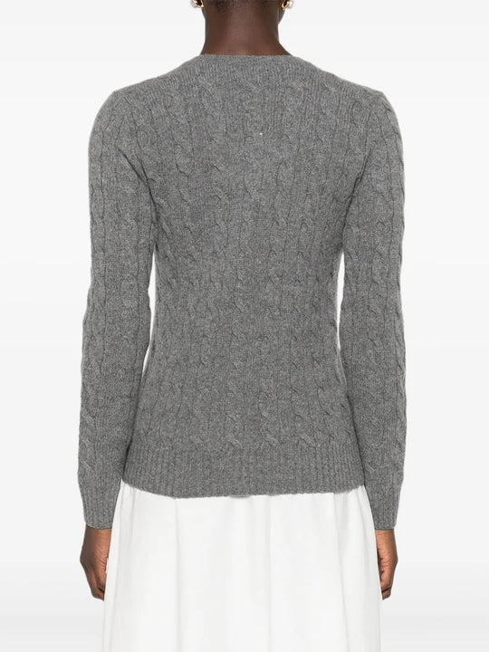 Grey sweater worn by a person, showing the sweater's fit