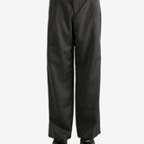 Brown pants worn by a person, showing the pants's fit