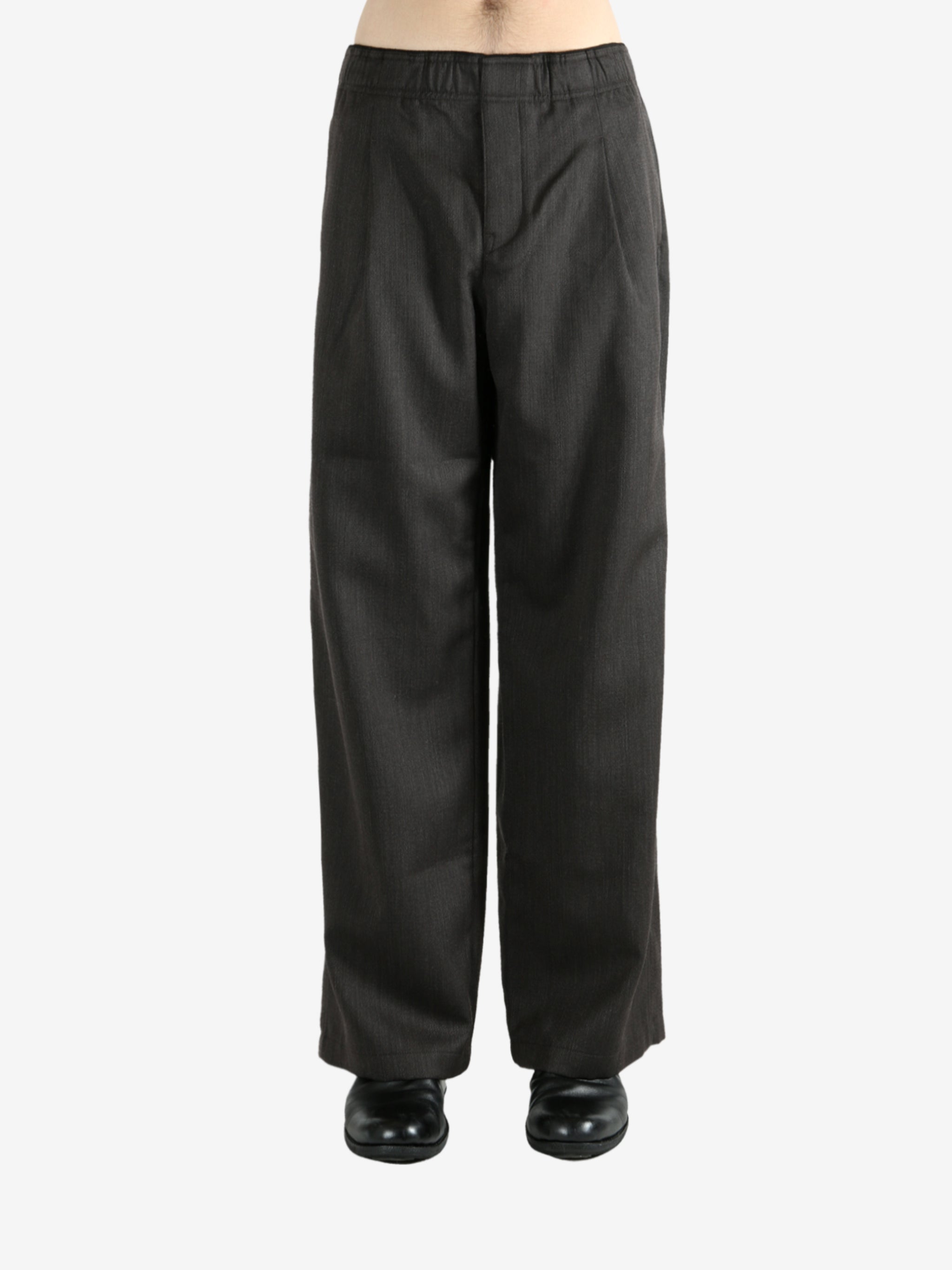 Brown pants worn by a person, showing the pants's fit