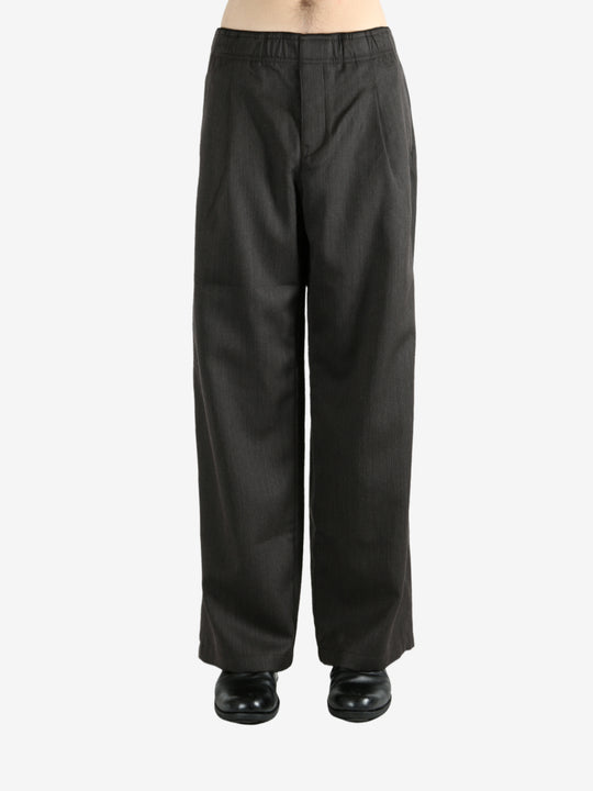 Brown pants worn by a person, showing the pants's fit