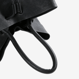 Close up of black bags, showing texture of the calf leather fabric