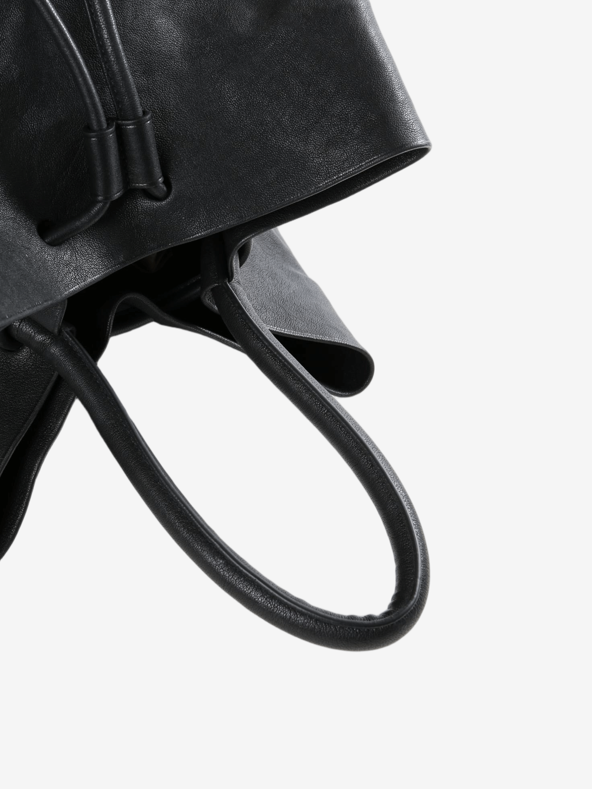 Close up of black bags, showing texture of the calf leather fabric