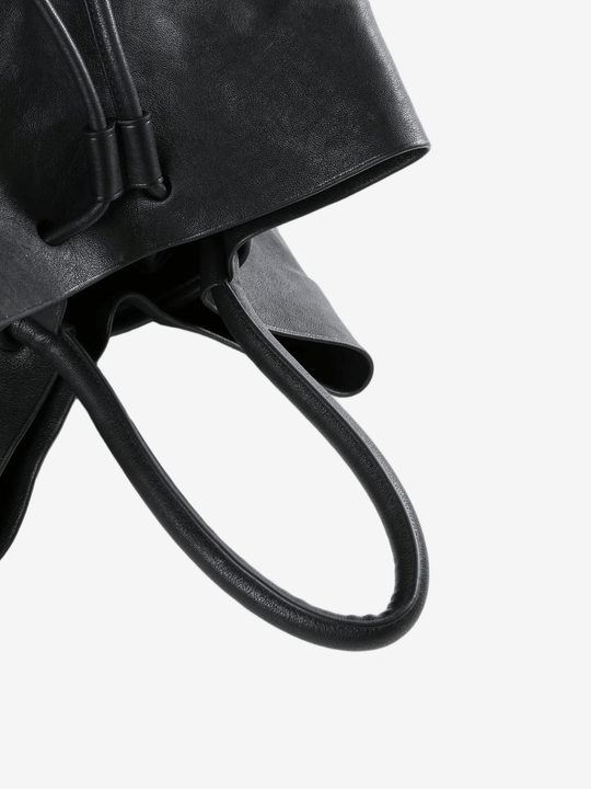 Close up of black bags, showing texture of the calf leather fabric