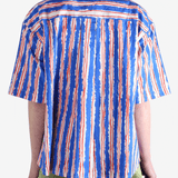 Blue shirts worn by a person, showin the shirt's fit