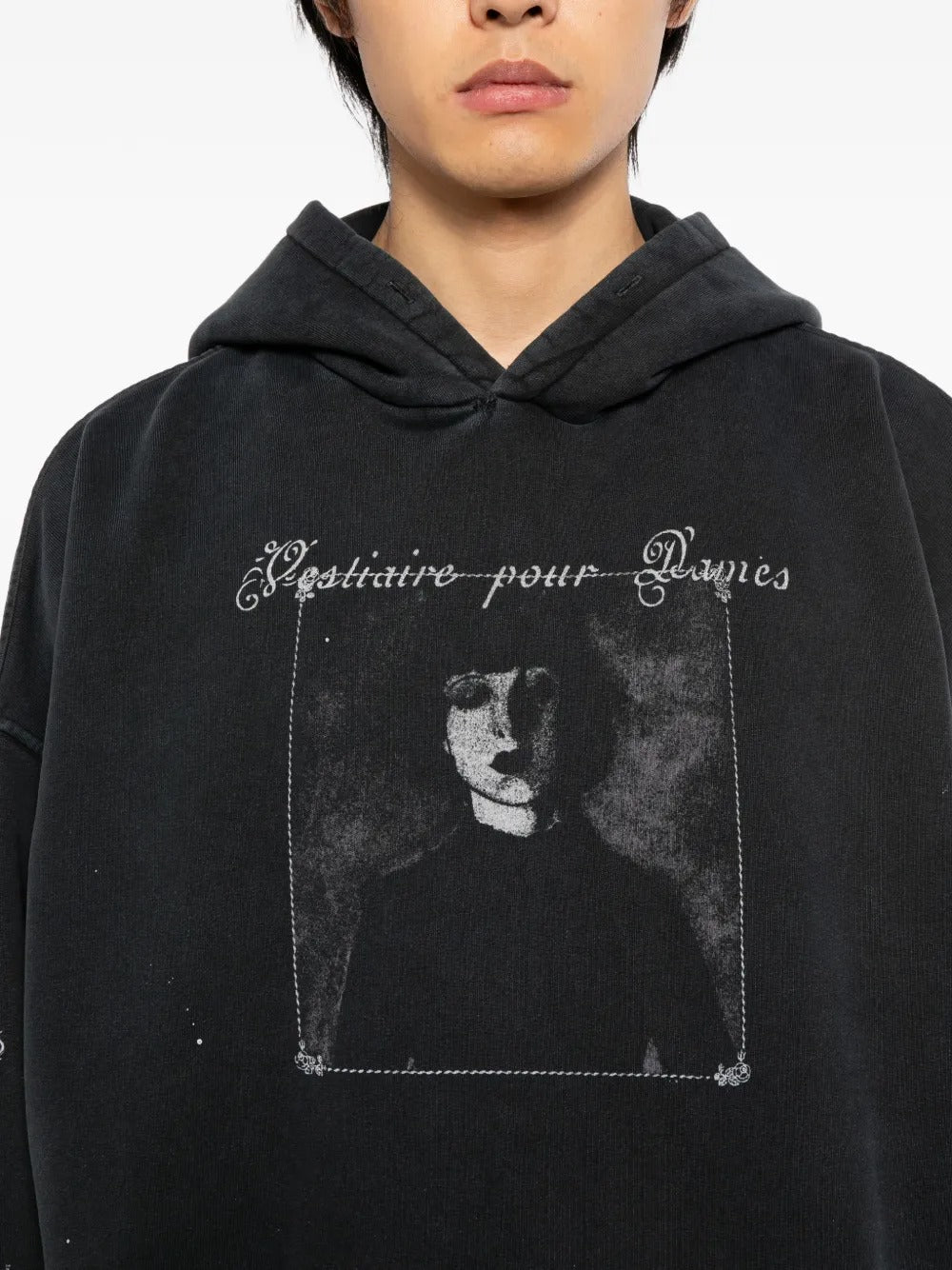 Close up of the black hoodie, showing texture of the cotton fabric