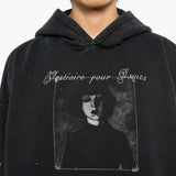Close up of the black hoodie, showing texture of the cotton fabric