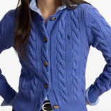 Blue knitwear worn by a person, showing the knitwear fit