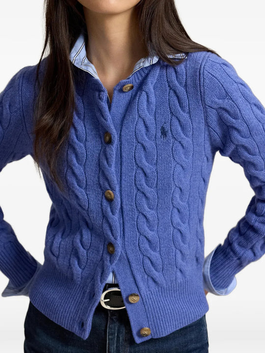 Blue knitwear worn by a person, showing the knitwear fit