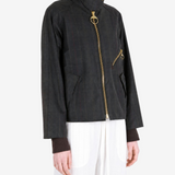 Black jacket worn by a person, showing the jacket fit