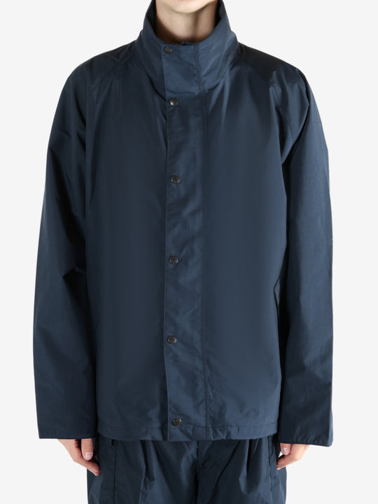 Navy jacket worn by a person, showing the jacket's fit