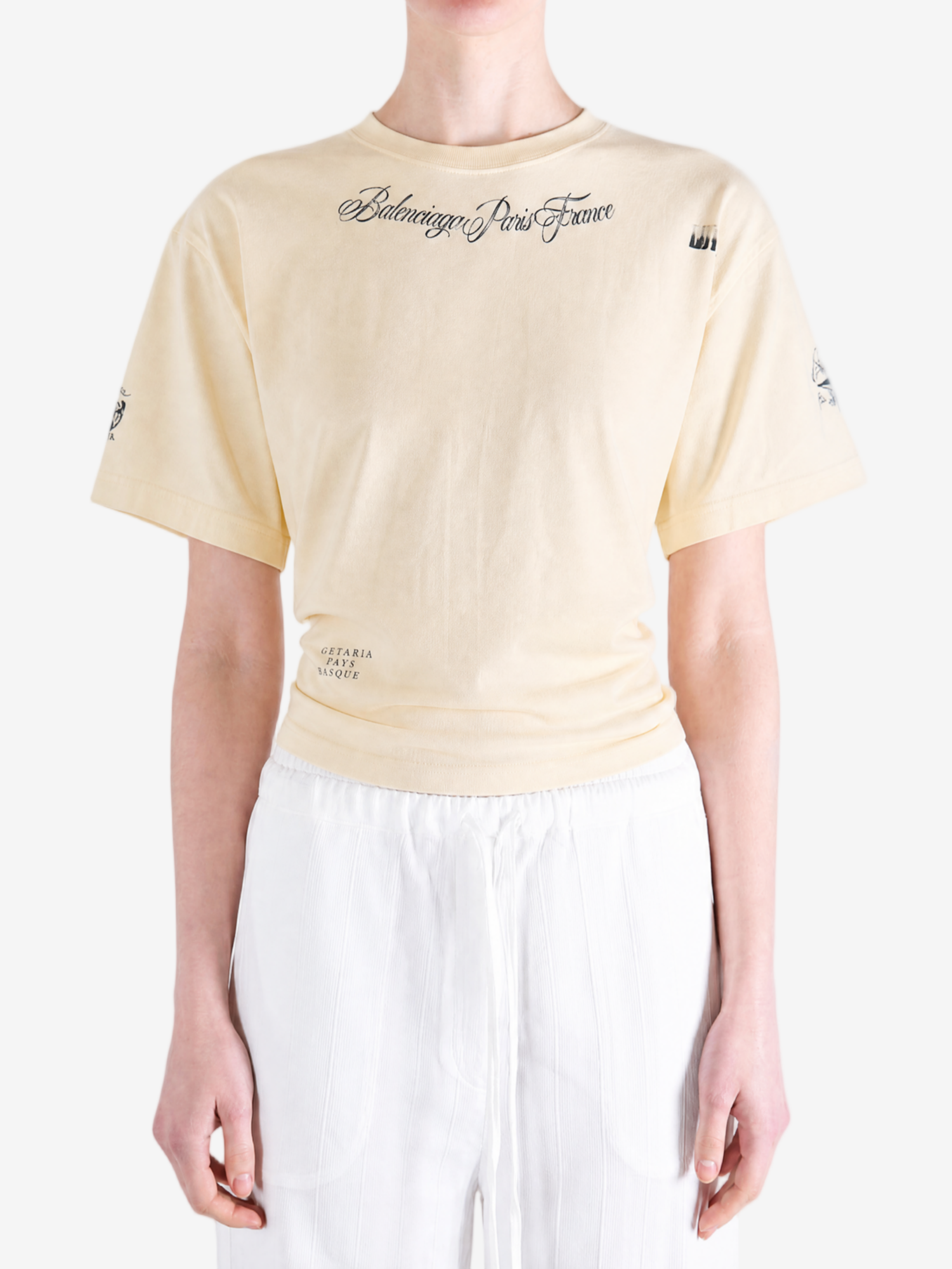 Tan top worn by a person, showing the top fit