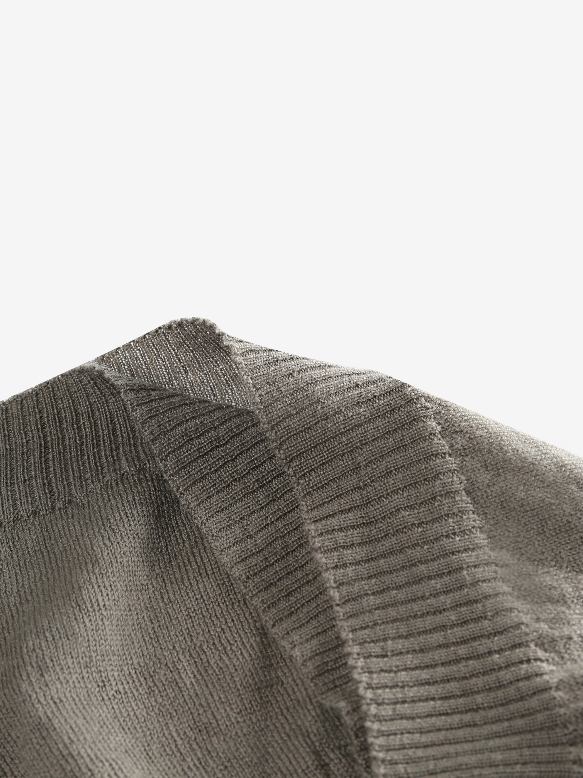 Close up of grey hats, showing texture of the wool fabric