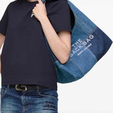 Blue bag worn by a person, showing the bag's fit