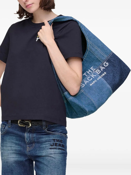 Blue bag worn by a person, showing the bag's fit