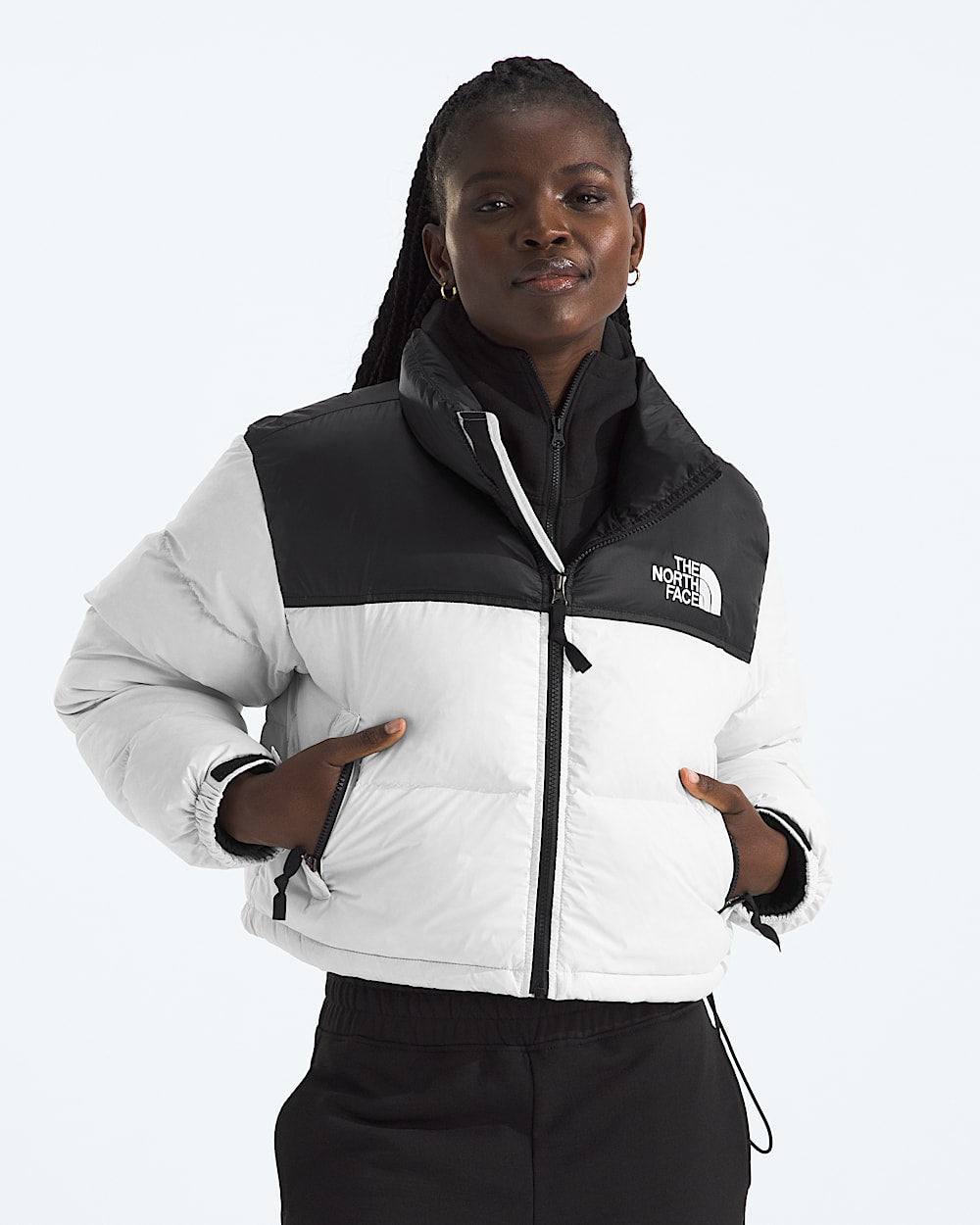 White jacket worn by a person, showing the jacket fit