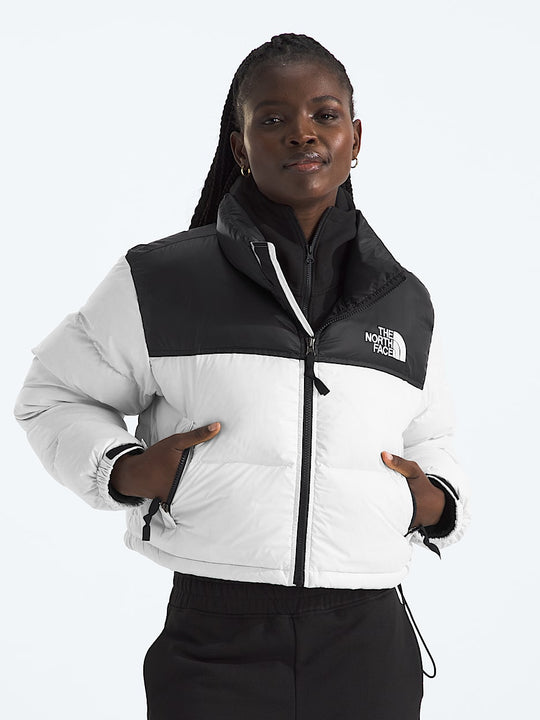 White jacket worn by a person, showing the jacket fit