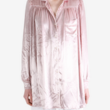 Pink dress worn by a person, showing the dress fit