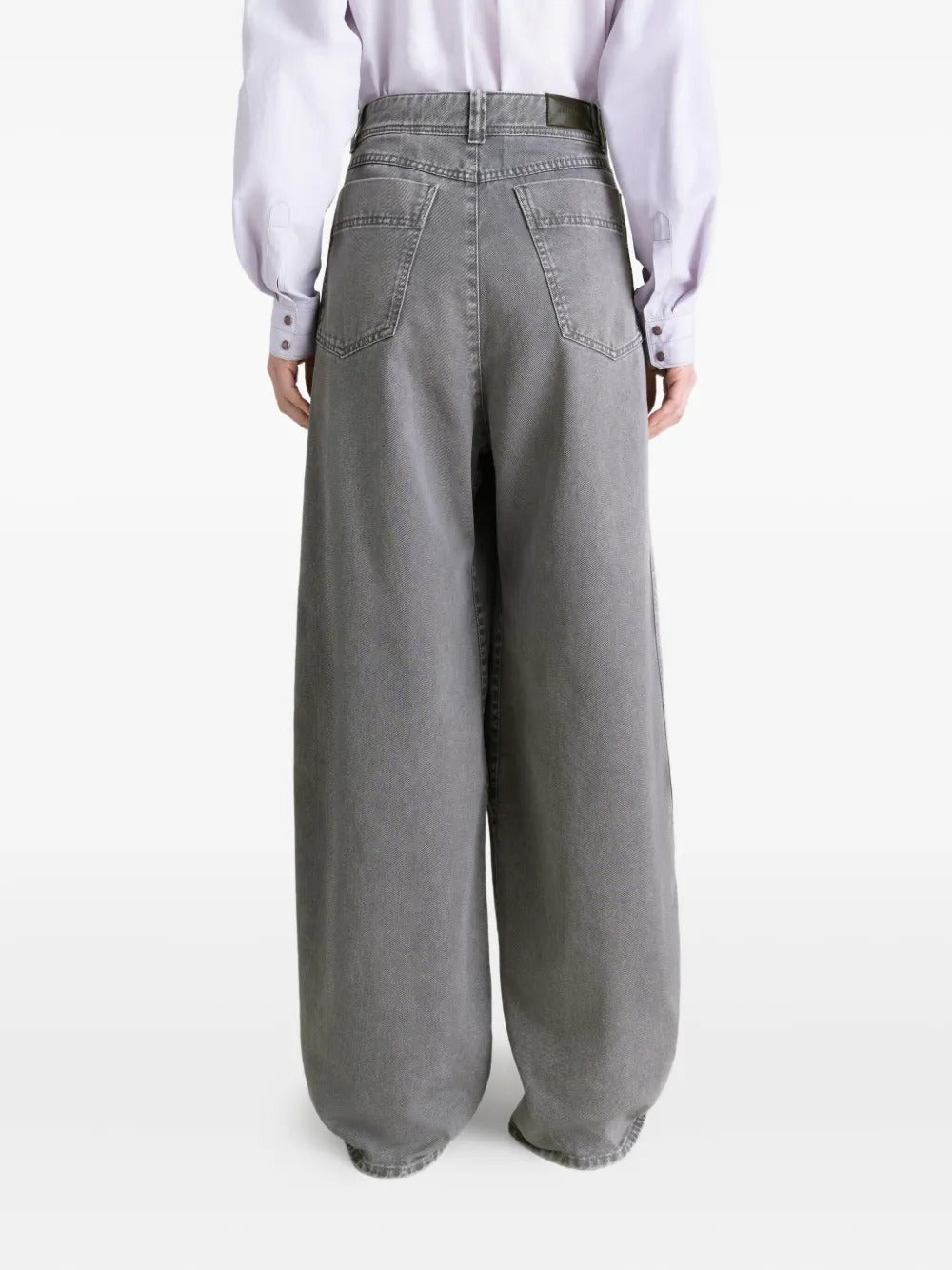 Grey pants worn by a person, showing the pants' fit