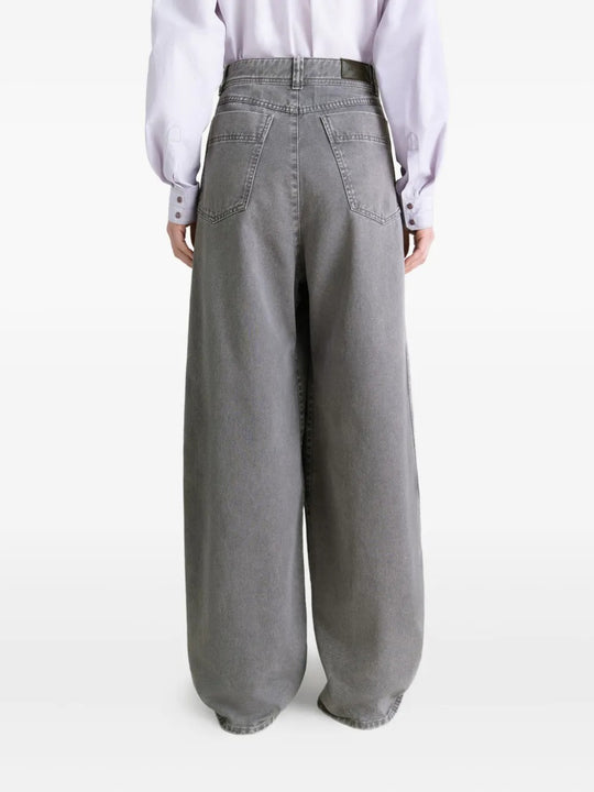 Grey pants worn by a person, showing the pants' fit