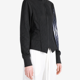 Black top worn by a person, showing the top fit