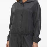 grey hoodie worn by a person, showing the hoodie fit