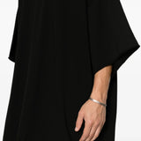 Black t-shirt worn by a person, showing the t-shirt fit