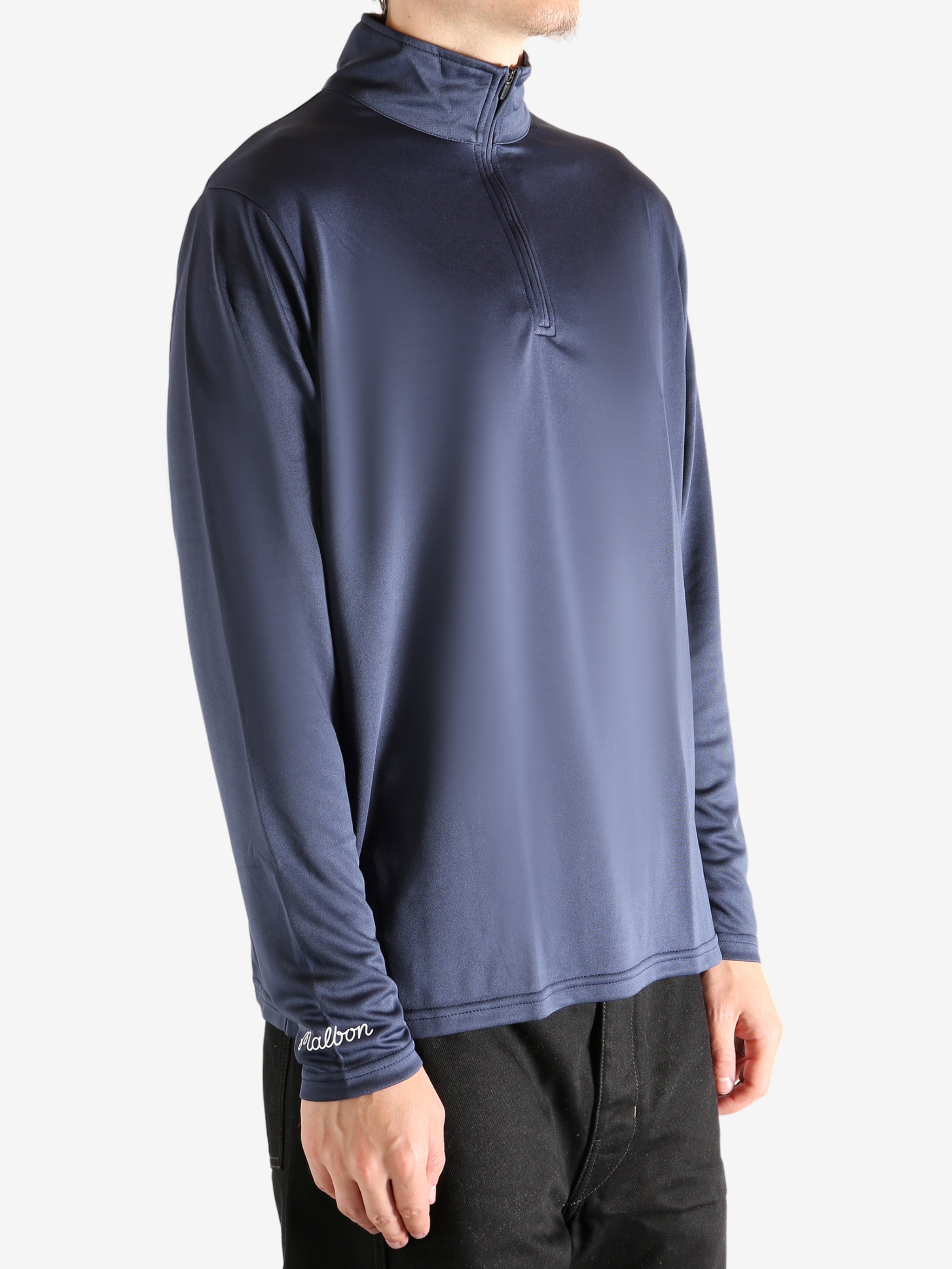 Navy pullover worn by a person, showing the pullover's fit