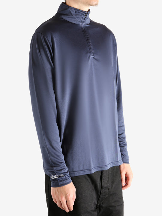 Navy pullover worn by a person, showing the pullover's fit