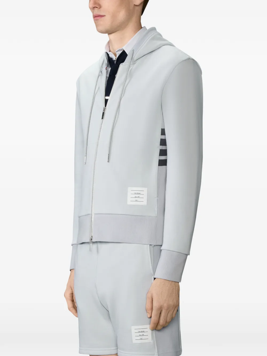 White t-shirt worn by a person, showing the t-shirt fit