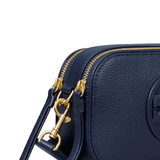 Close up of the navy bag, showing texture of the leather fabric