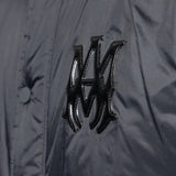 Close up of the black jacket, showing texture of the nylon fabric