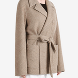 Tan jacket worn by a person, showing the jacket fit