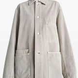 White shirt worn by a person, showing the shirt's fit