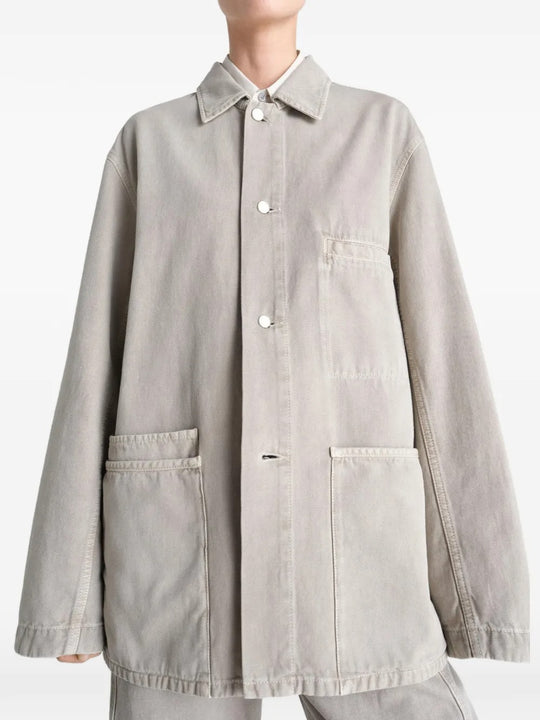 White shirt worn by a person, showing the shirt's fit