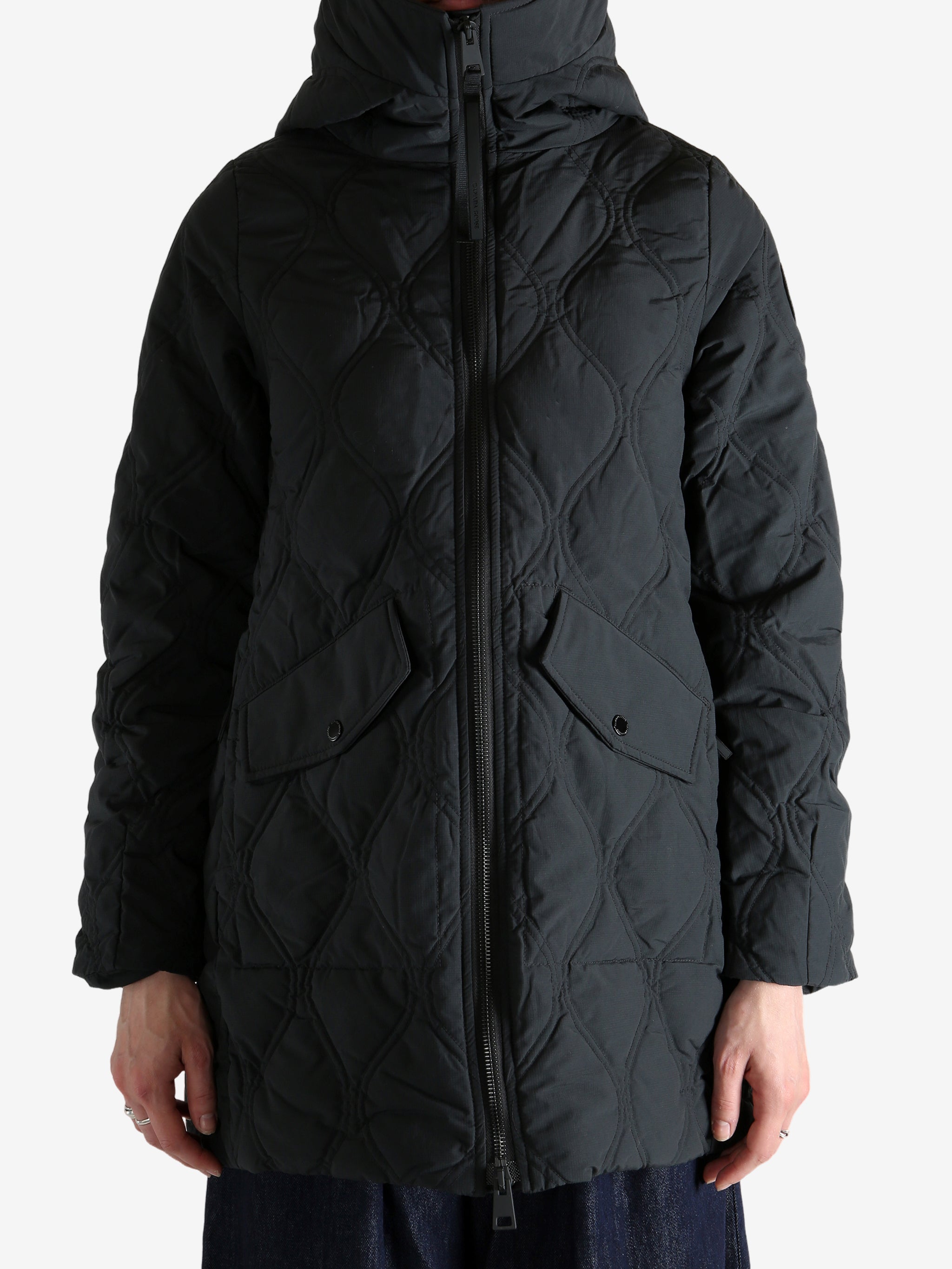 Black jacket worn by a person, showing the jacket's fit