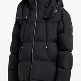 Black coat worn by a person, showing the coat fit