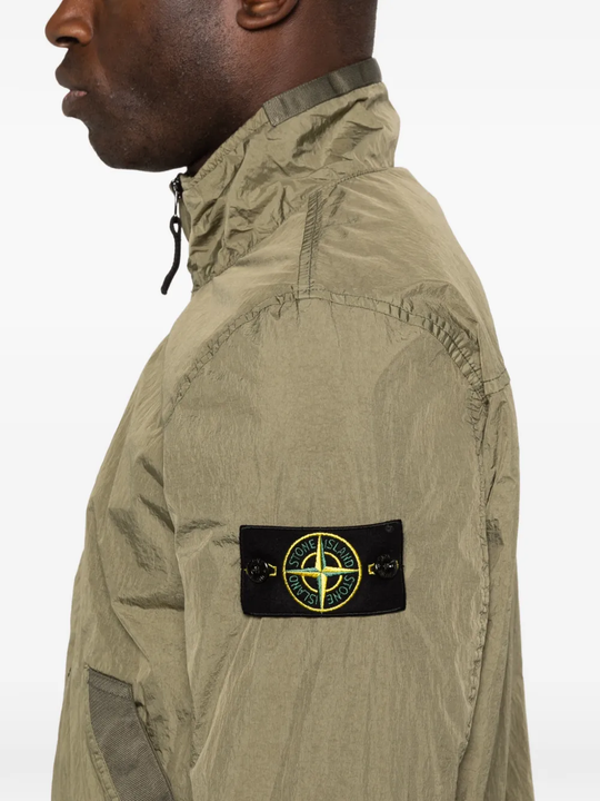 Close up of green jackets, showing texture of the Polyurethane Resin and Polyamide fabric 
