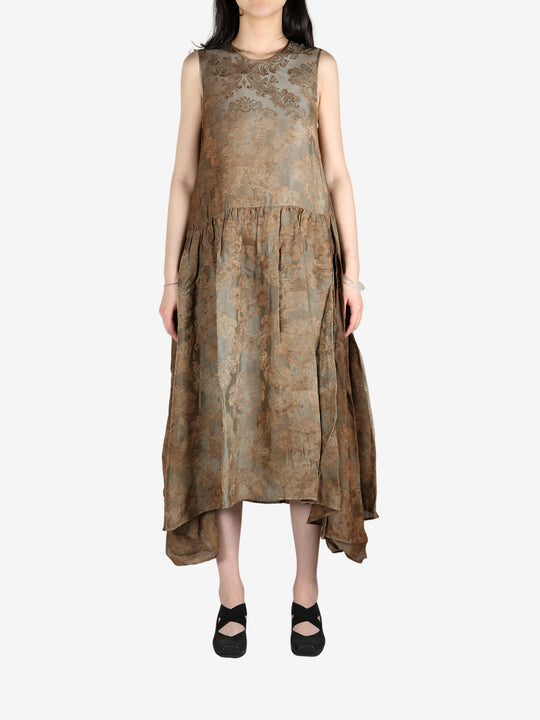 Brown dress worn by a person, showing the dress's fit