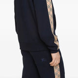 Close up of the navy hoodie, showing texture of the cotton fabric